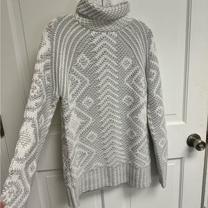 Grey and white knitted turtle neck sweater